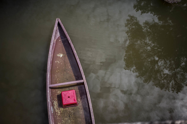 Red Boat on Lake Tu Duc Tomb Hue Vietnam